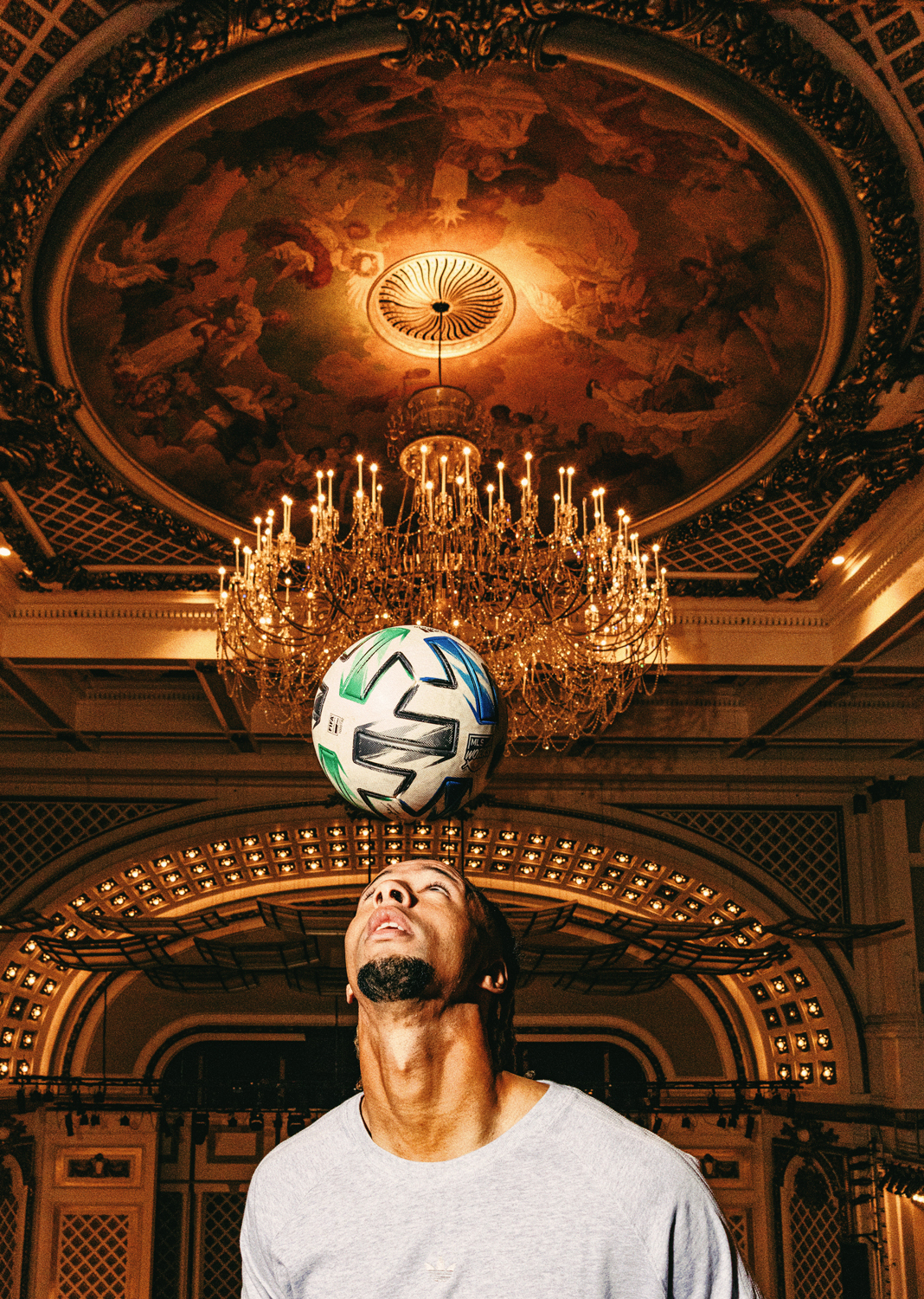 FC Cincinnati player Ayoub Jabbari juggles a soccer ball beneath a chandelier in Cincinnati's Music Hall. 