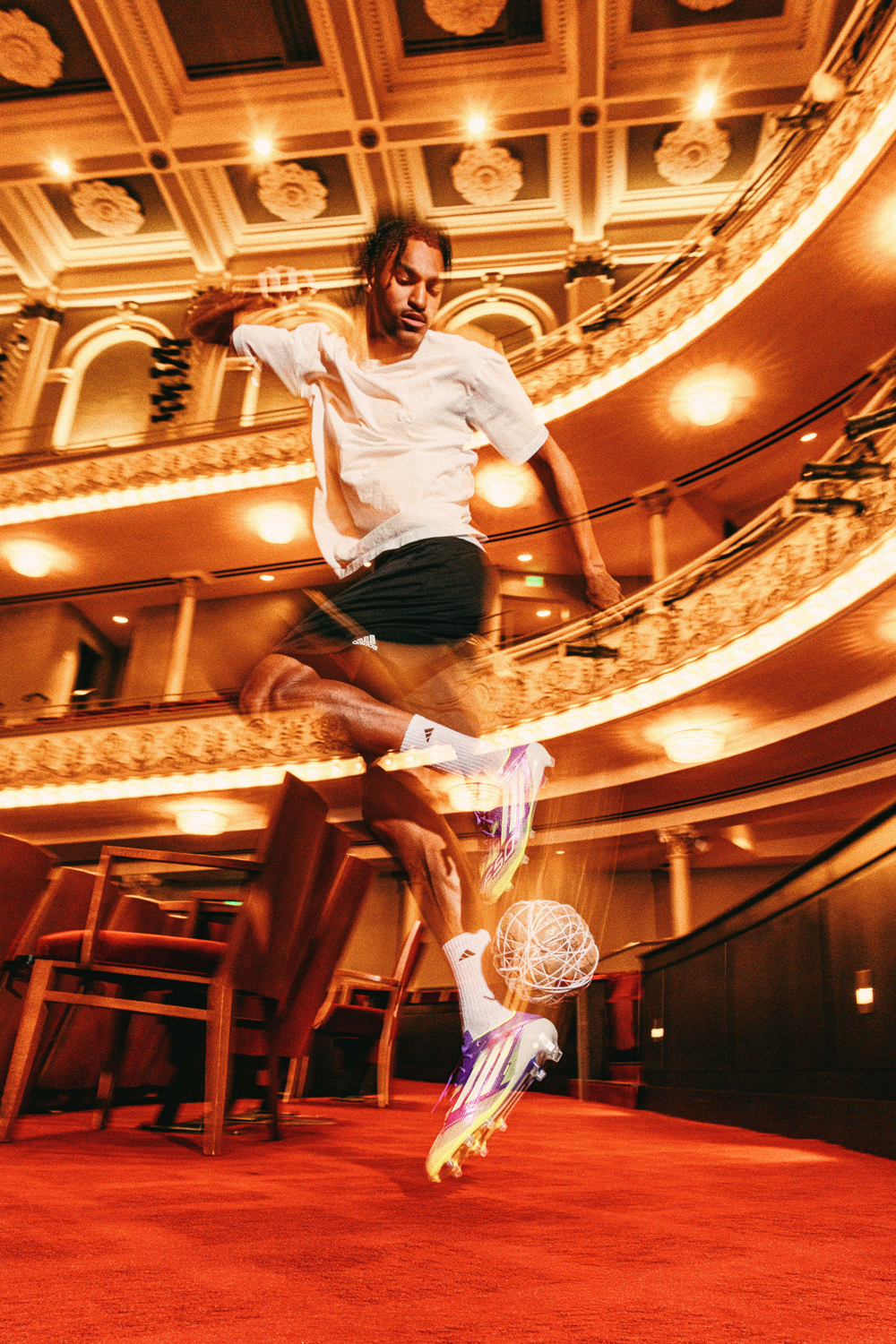 Kenji Mboma Dem performs a rainbow flick with a ball made of plastic bags and string in Music Hall in Cincinnati. 
