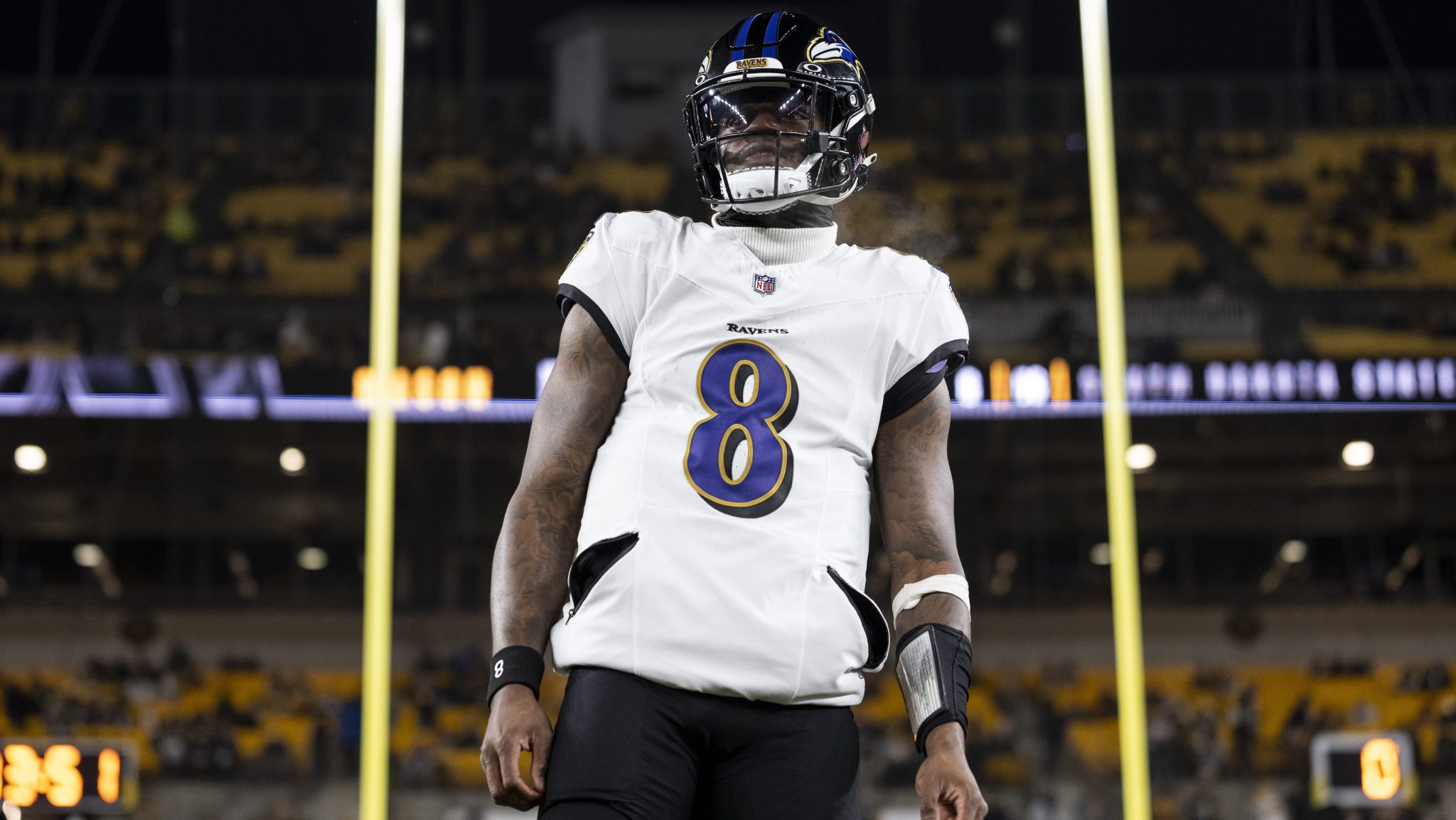 Lamar Jackson stands in front of the uprights.