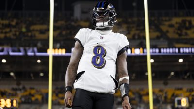 Lamar Jackson stands in front of the uprights.
