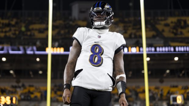 Lamar Jackson stands in front of the uprights.