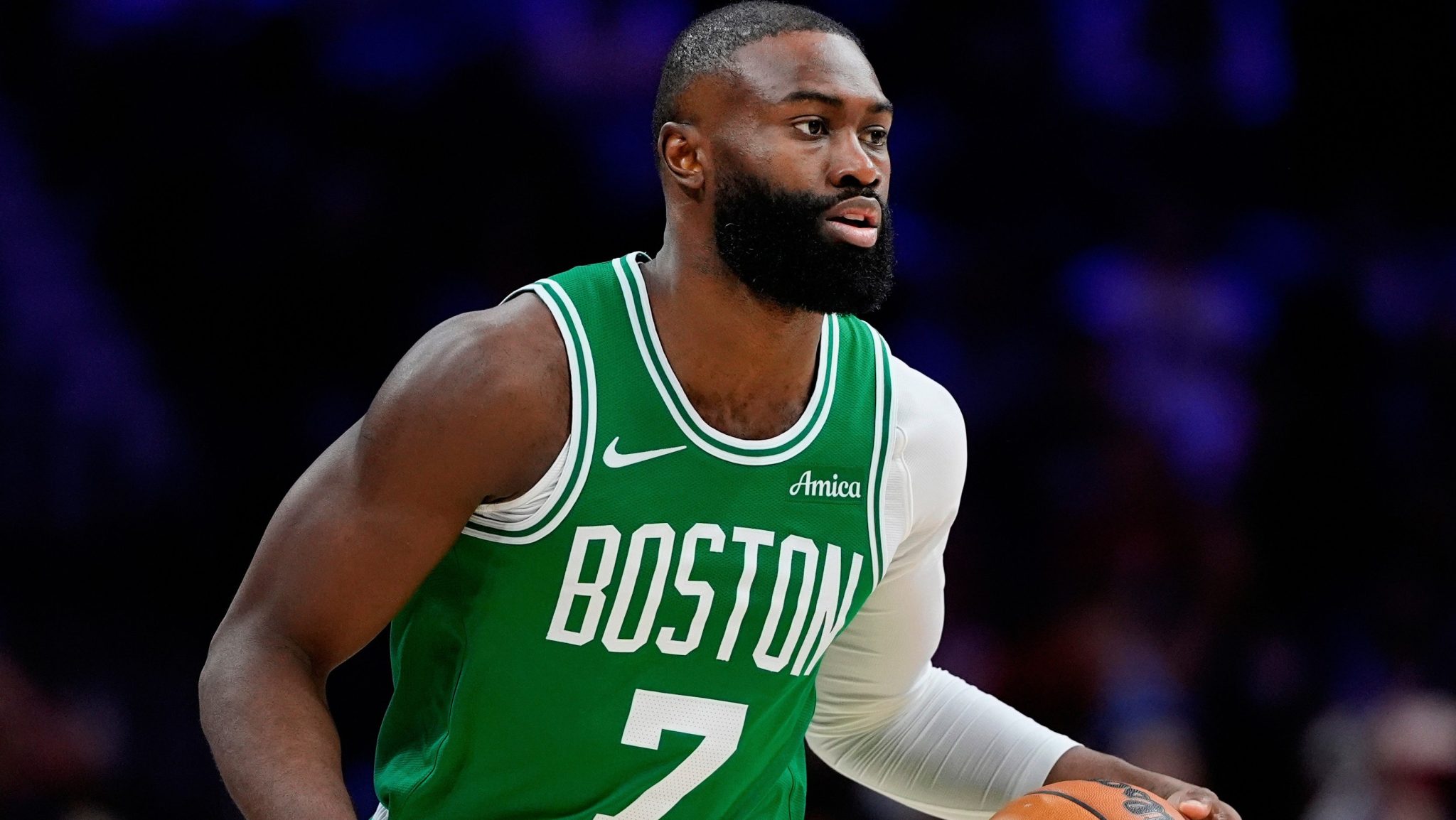 Jaylen Brown dribbles the ball.