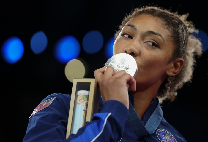 
Team USA's Kennedy Blades kisses her silver medal after falling to Japan's Yuka Kagami 3-1 in the final match of the women's 76kg freestyle wrestling on Aug. 11, 2024, at Champ de Mars Arena during the Paris Olympics.