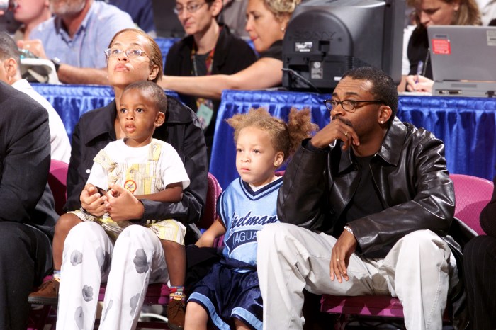 Film director Spike Lee and family attend the inaugural WNBA All-Star Game at Madison Square Garden.