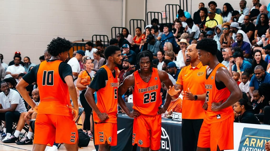 Team Takeover on the sidelines listening to Jamill Jones.