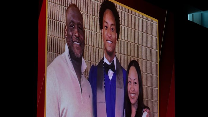 A video with still images of Nolan Wells and his parents Christine Wonsley and Elmore Wonsley is shown.