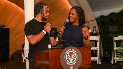 Jalen and Sandra Brunson address crowd at the Second Round Foundation