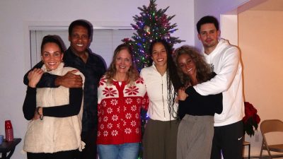 Golden State Valkyries guard Veronica Burton (third from right) poses for a holiday photo with her parents, two sisters and brother.