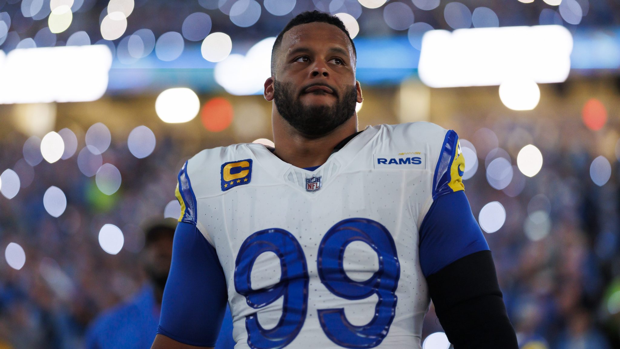 Aaron Donald with lights in the background.