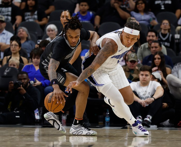Paolo Banchero tries to make a steal on Stephon Castle