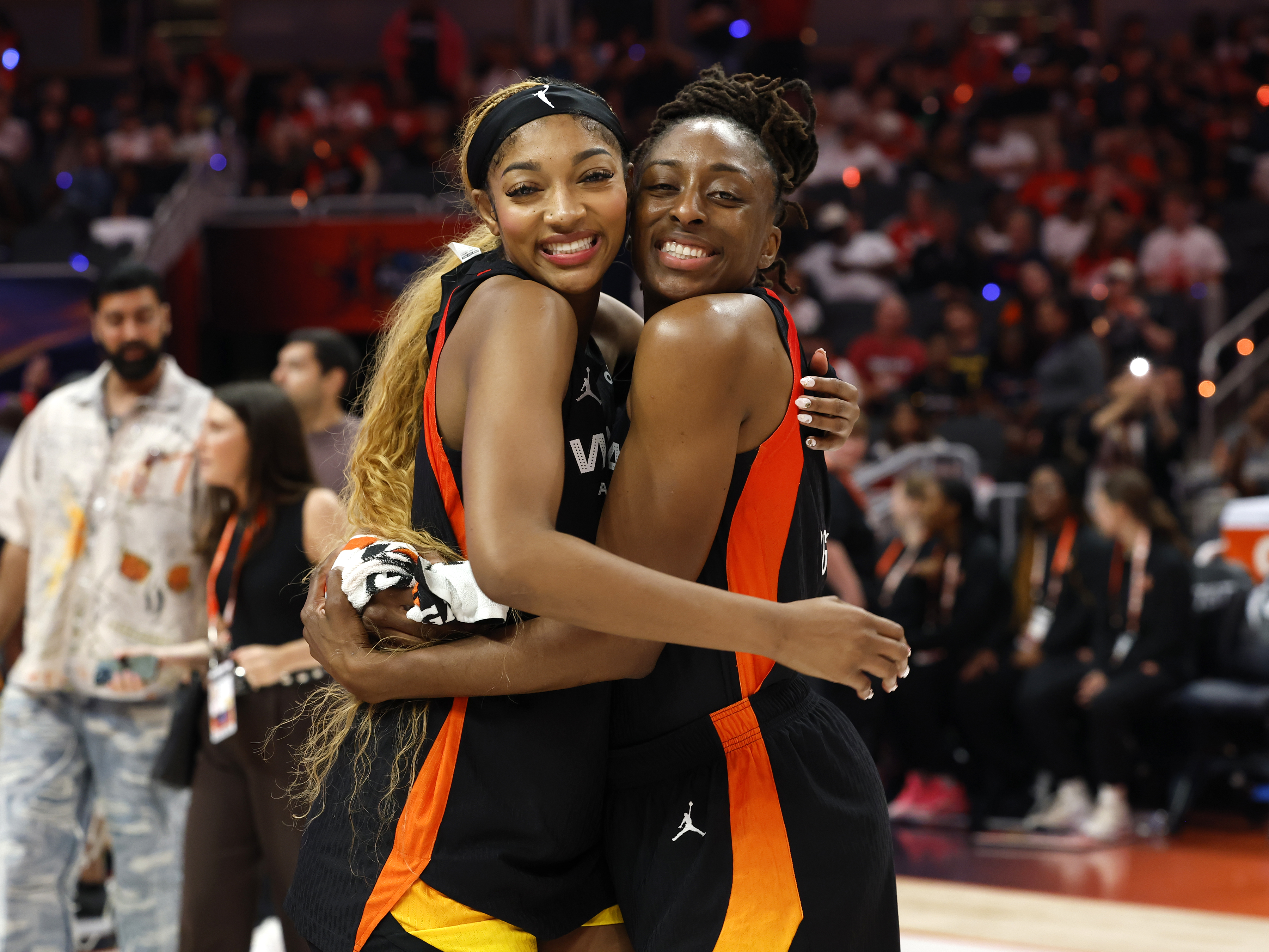 Angel Reese (from left) and Nneka Ogwumike embrace during the 2025 WNBA All-Star Game on July 19, 2025, at Gainbridge Fieldhouse in Indianapolis.