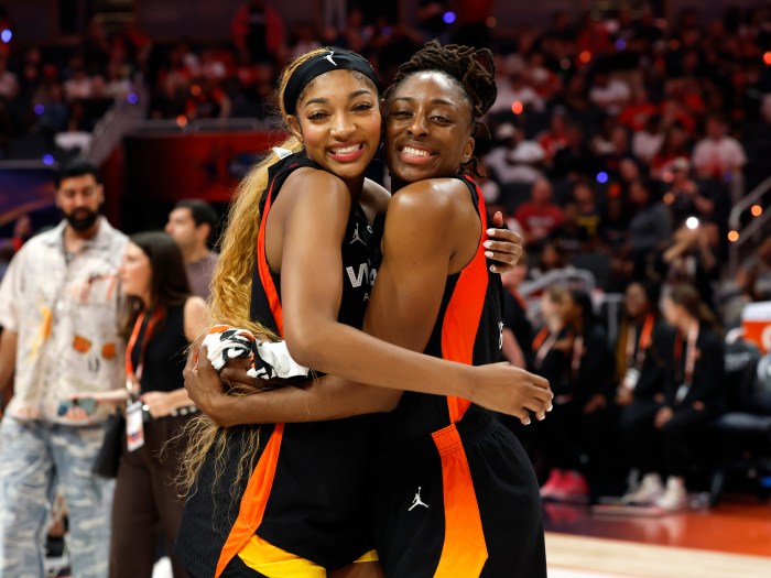 Angel Reese (from left) and Nneka Ogwumike embrace during the 2025 WNBA All-Star Game on July 19, 2025, at Gainbridge Fieldhouse in Indianapolis. 