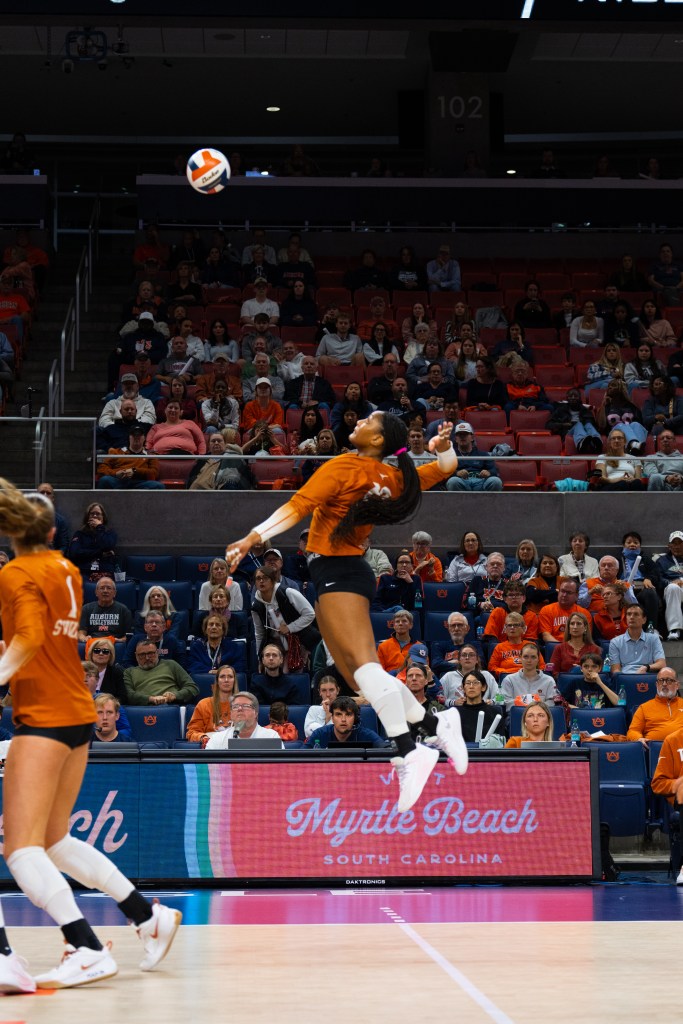 Texas volleyball player Cari Spears spikes the ball during a match against Auburn on Nov. 12, 2025, in Auburn, Alabama. 