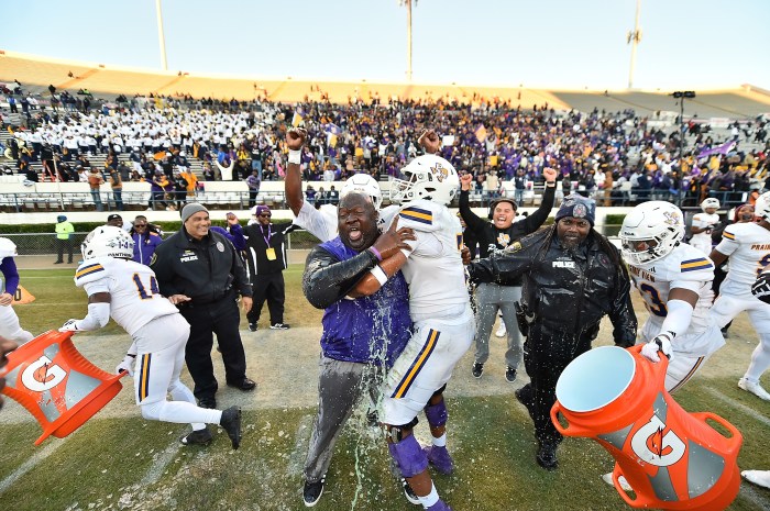 Prairie View A&M players pour Gatorade on head coach Tremaine Jackson after winning the 2025 Southwestern Athletic Conference championship game on Dec. 6, 2025, at Mississippi Veterans Memorial Stadium in Jackson, Miss.