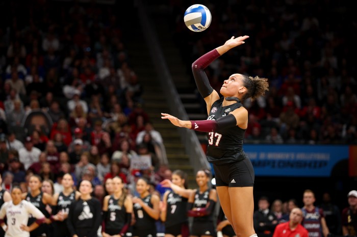 Kyndal Stowers of the Texas A&M Aggies serves against the Kentucky Wildcats during the Division I women's volleyball championship on Dec. 21, 2025, at T-Mobile Center in Kansas City, Mo. 