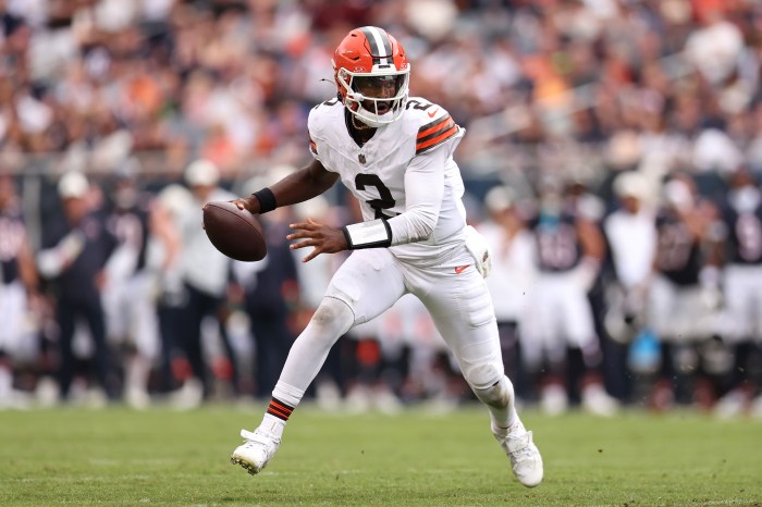 Shedeur Sanders drops back to pass