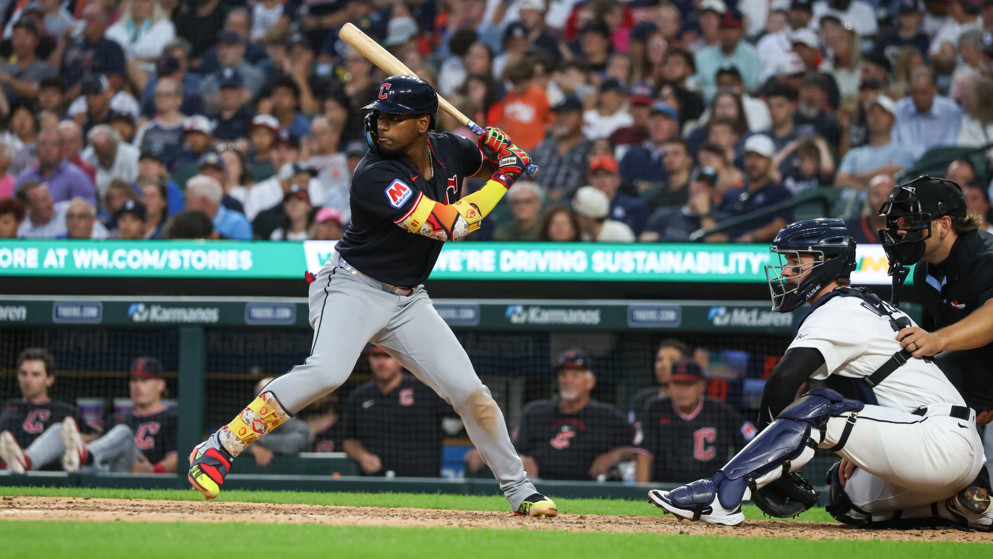 Jo Adell holds the bat and is getting ready to swing at the plate.