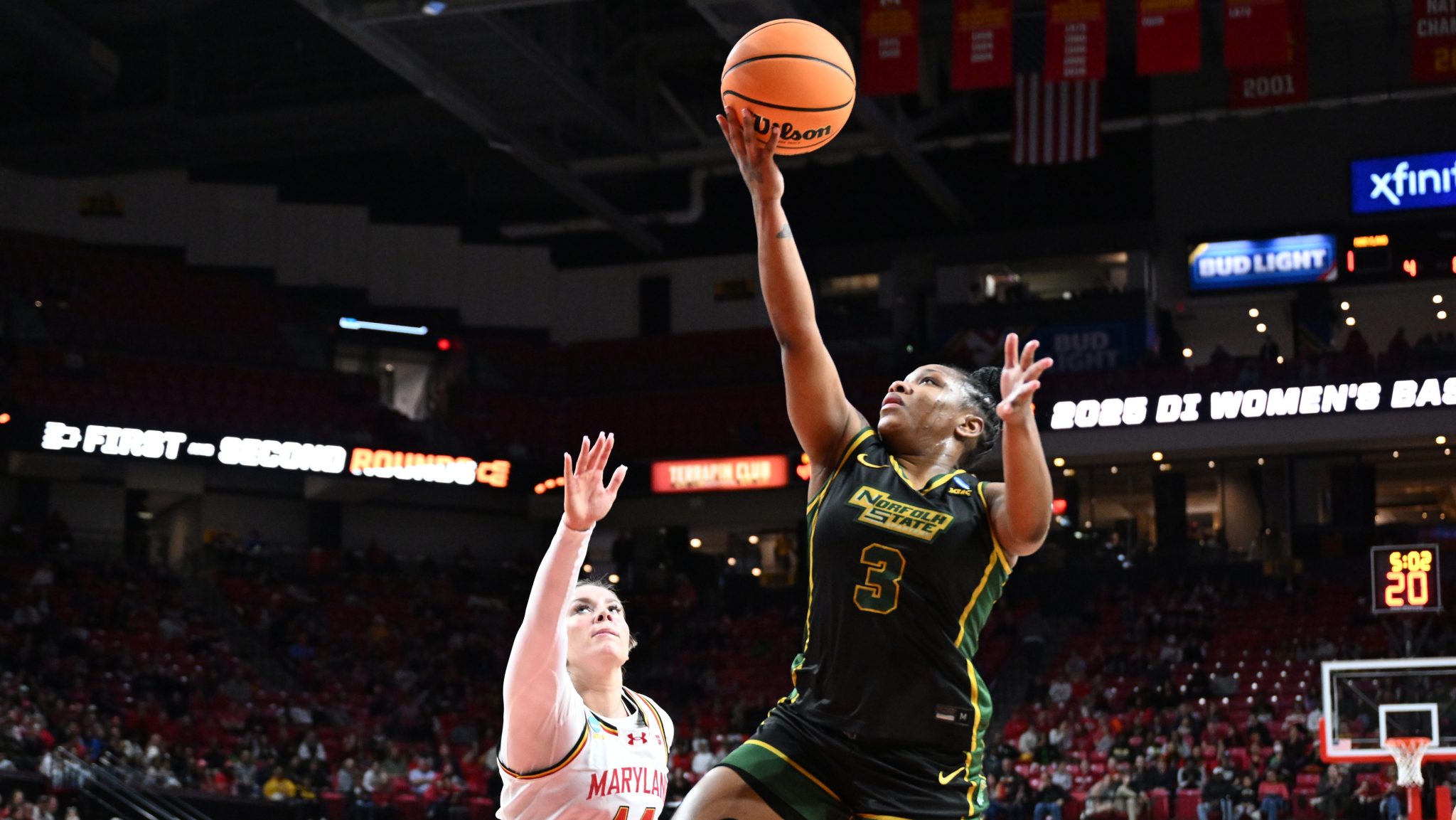 Diamond Johnson of Norfolk State (right) shoots over Allie Kubek (left) of Maryland during the first round of the 2025 women's NCAA tournament on March 22, 2025, at Xfinity Center in College Park, Md.