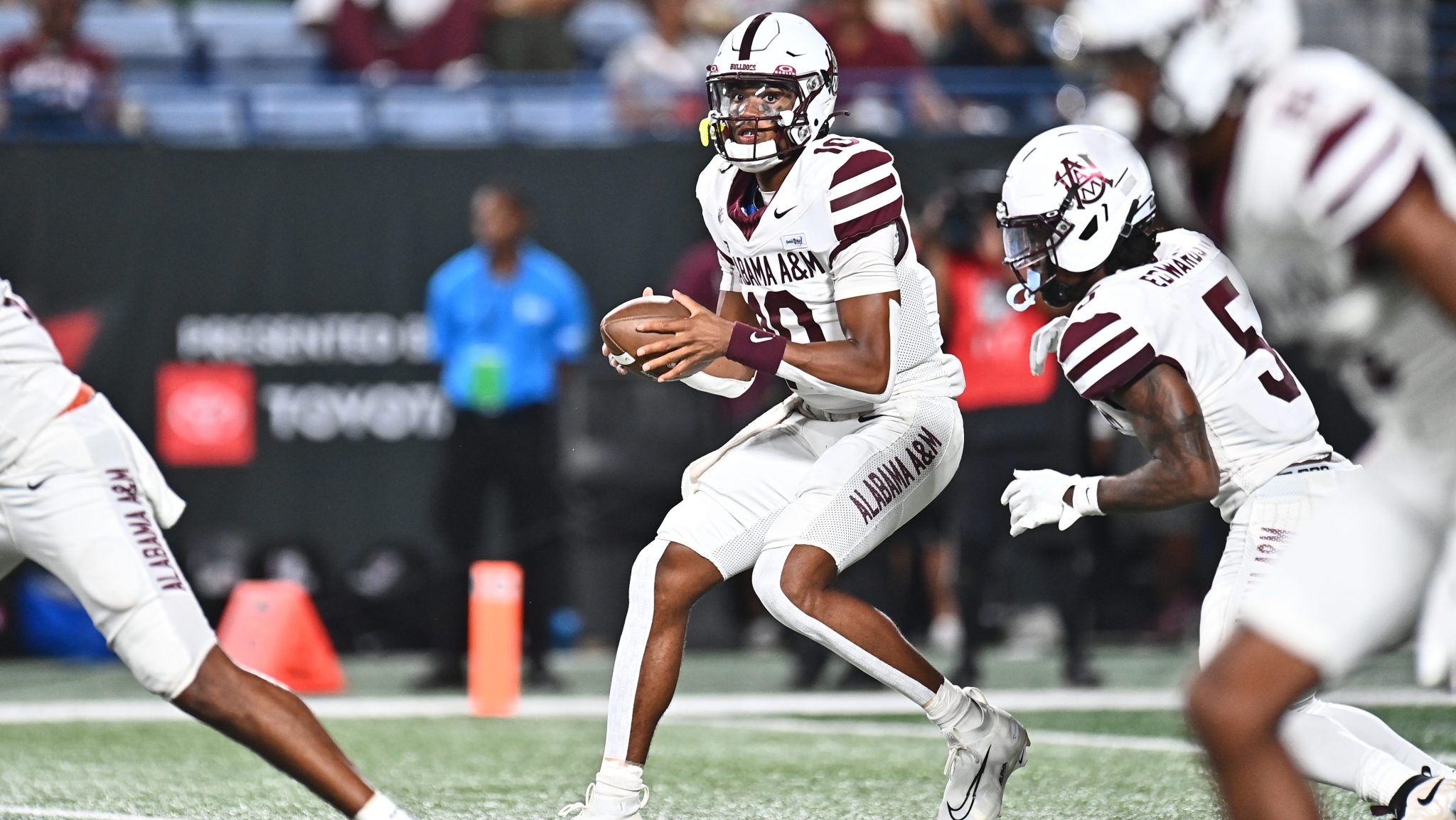 Alabama A&M quarterback Cornelious "Quad" Brown IV (center) looks to throw the ball during the 2026 Cricket MEAC/SWAC Challenge Kickoff on Aug. 29, 2026, at Center Parc Stadium in Atlanta.