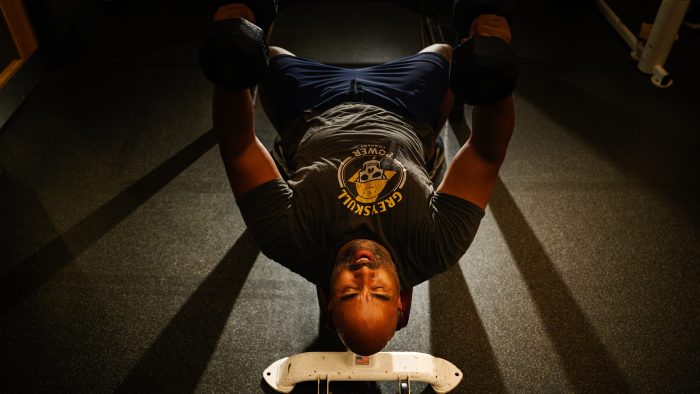 Nick Johnson lifts weights at the Earlham College