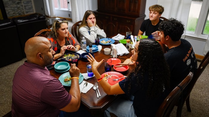 Nick Johnson and his family have dinner in their new home