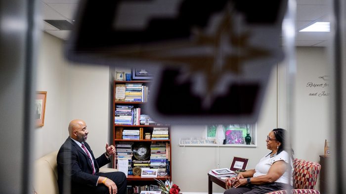 Nick Johnson speaks to Bonita Washington-Lacey, vice president for student life, dean of students, in her office