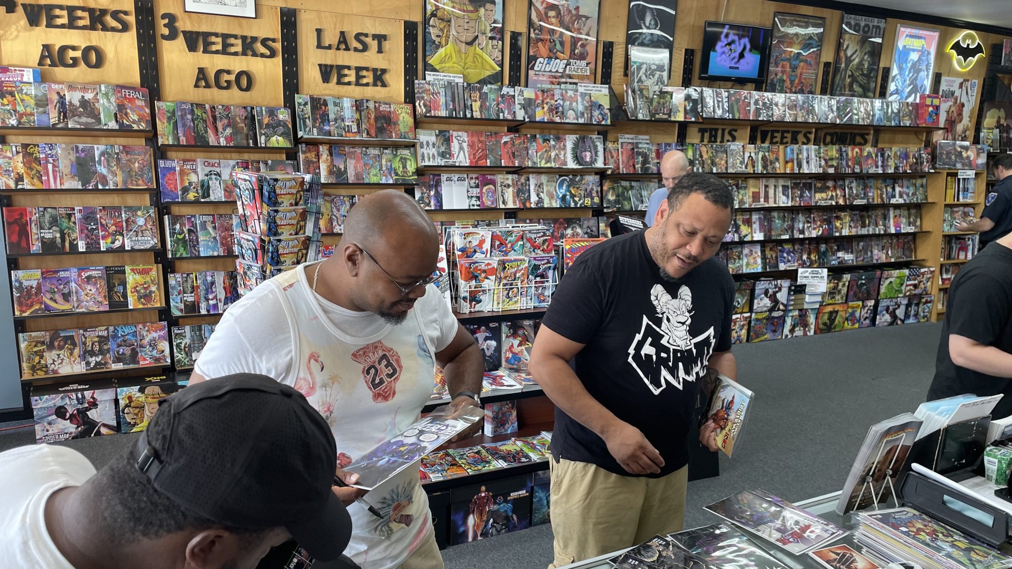 Customers browse comic books at Acme Comics