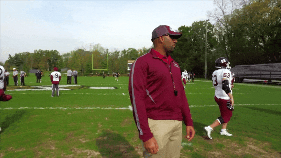 Gif of Nick Johnson walking the field and talking to his players.