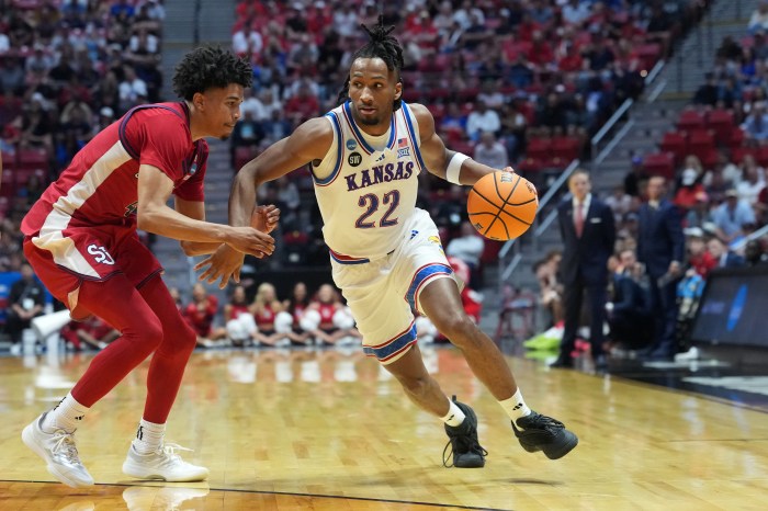 Kansas Jayhawks guard Darryn Peterson drives past a defender.