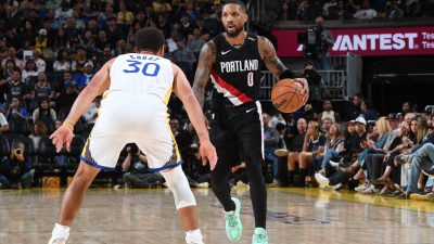 Damian Lillard brings the ball up the court.