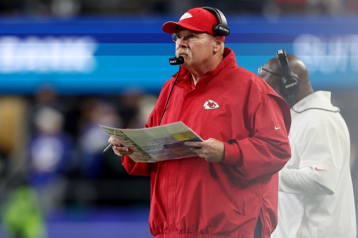 Andy Reid watches from the sidelines.