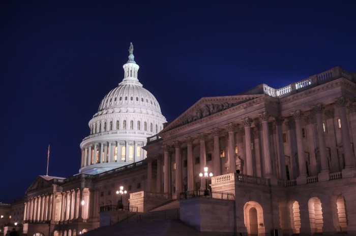 An image at night of the outside of the United States Capitol.