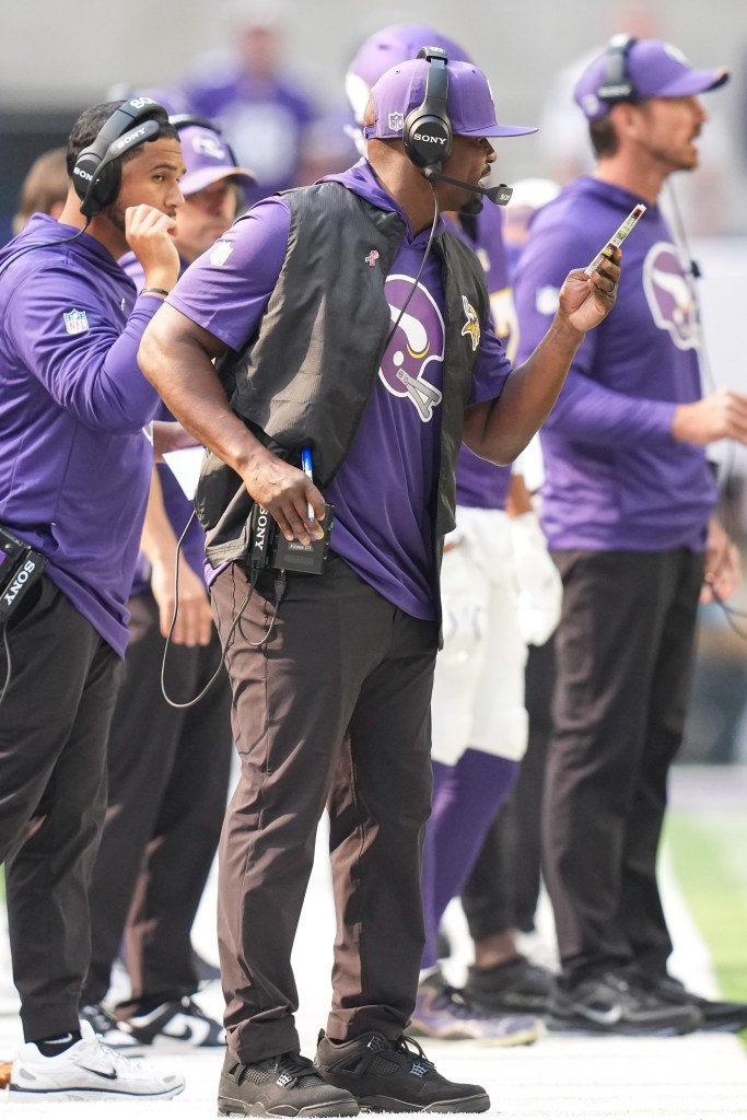 Brian Flores calls a play during the game