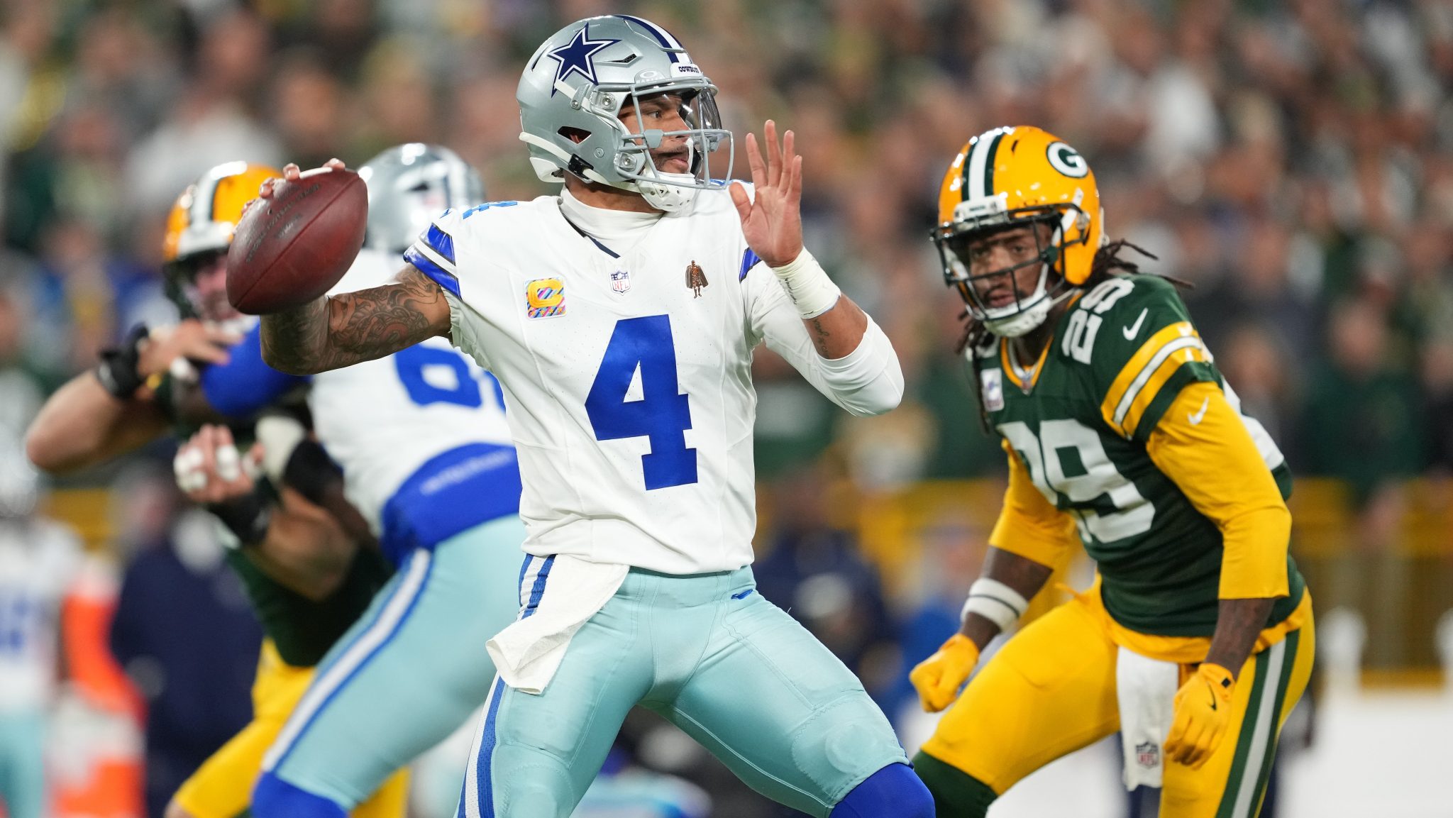 Dak Prescott throws a pass