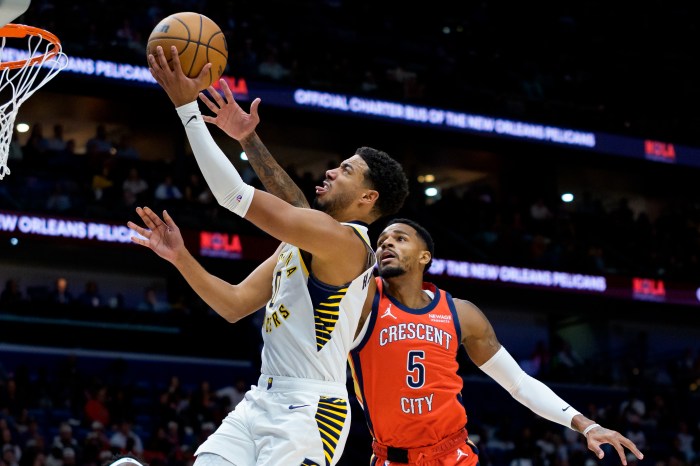Dejounte Murray defends against guard Tyrese Haliburton