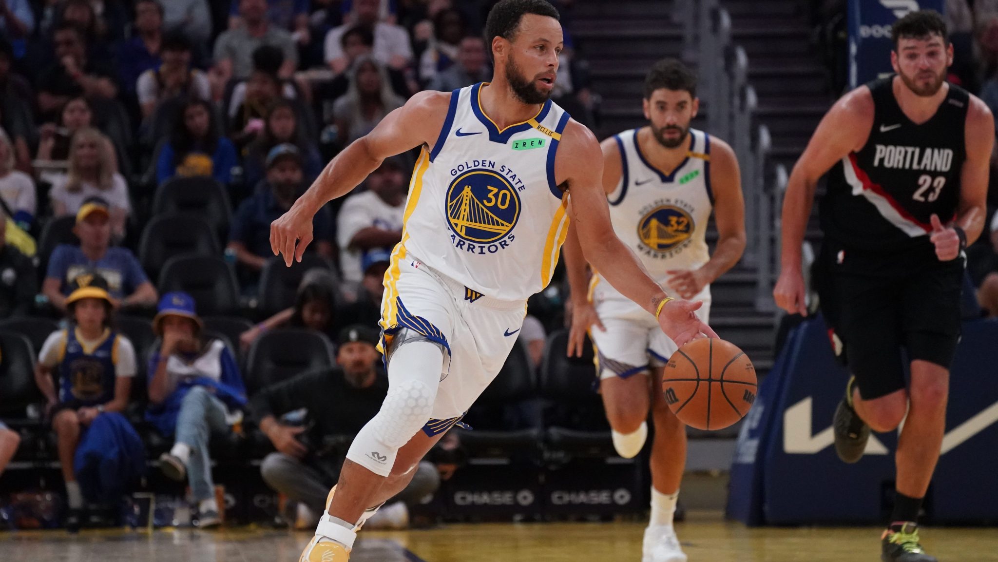 Stephen Curry brings the ball up the court.